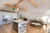 Modern home with Dining Room, Chair, Table, Bar, Bench, Storage, Stools, Ceiling Lighting, Shelves, and Medium Hardwood Floor. Kitchen and dining rooms Photo 6 of Bayview Road