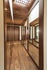 Modern home with Hallway and Medium Hardwood Floor. Hall of mirros leading into Master Bathroom and closets Photo 10 of La Jolla Modern