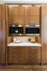 Modern home with Kitchen, Wood Cabinet, Stone Slab Backsplashe, Engineered Quartz Counter, Medium Hardwood Floor, Ceiling Lighting, Wall Oven, Refrigerator, and Microwave. Coffee Nook Photo 9 of La Jolla Modern