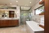 Modern home with Bath Room, Granite Counter, Undermount Sink, Limestone Floor, Freestanding Tub, Open Shower, Pendant Lighting, Recessed Lighting, Stone Tile Wall, and One Piece Toilet. Master Bathroom Photo 11 of La Jolla Modern