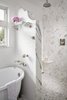 Modern home with Bath Room, Marble Counter, Marble Floor, Open Shower, Ceiling Lighting, One Piece Toilet, Freestanding Tub, and Marble Wall. Master Bathroom Photo 9 of Mission Hills Modern