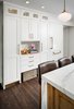 Modern home with Kitchen, Marble Counter, White Cabinet, Wood Cabinet, Stone Slab Backsplashe, Refrigerator, Pendant Lighting, Dark Hardwood Floor, and Recessed Lighting. Fridge/Freezer wall Photo 6 of Mission Hills Modern