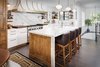 Modern home with Kitchen, Marble Counter, Wood Cabinet, Wood Counter, Metal Cabinet, White Cabinet, Medium Hardwood Floor, Stone Slab Backsplashe, Wall Lighting, Pendant Lighting, Accent Lighting, Ceiling Lighting, Range, Cooktops, Refrigerator, Range Hood, Dishwasher, and Undermount Sink. Kitchen Photo of Mission Hills Modern