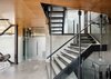 Modern home with Staircase, Metal Railing, Concrete Tread, and Metal Tread. A central stair allows for passive ventilation through the home, while serving as the homes central axis. Photo 4 of Skyline Residence