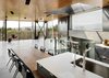 Modern home with Kitchen, Ceiling Lighting, Wood Counter, Engineered Quartz Counter, Stone Counter, Metal Cabinet, Recessed Lighting, Accent Lighting, Concrete Floor, Undermount Sink, and Concrete Backsplashe. The kitchen opens to the open floor plate, allowing expansive views from any point in the space. Photo 8 of Skyline Residence