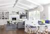 Modern home with Living Room, Bench, Bookcase, Chair, Coffee Tables, Sectional, End Tables, Ceiling Lighting, Gas Burning Fireplace, and Medium Hardwood Floor. Great Room: Kitchen Banquette and Family Room Photo 2 of Danville Transitional Remodel