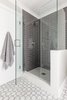 Modern home with Bath Room, Recessed Lighting, Enclosed Shower, Subway Tile Wall, Marble Floor, and Glass Tile Wall. Guest Bathroom Shower Photo 7 of Danville Transitional Remodel