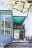 Modern home with Outdoor, Large Patio, Porch, Deck, Concrete Patio, Porch, Deck, Metal Patio, Porch, Deck, Front Yard, and Side Yard. Entrance, porch, and compact Dorgenois Residence as seen from the sidewalk Photo of Dorgenois