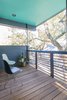 Modern home with Outdoor, Small Patio, Porch, Deck, Front Yard, Wood Patio, Porch, Deck, Trees, and Horizontal Fences, Wall. In addition to the generous side porch, the home includes a more intimate upstairs porch perched in the tree canopy. Photo 6 of Dorgenois