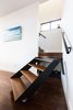 Modern home with Storage Room and Under Stairs Storage Type. The architects, owners of a New Orleans design build firm, fabricated a pivoting stair to allow access to under stair storage. Painting by Tiffany Lin. Photo 7 of Dorgenois
