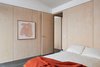 Modern home with Bedroom, Ceiling Lighting, Bed, Accent Lighting, and Concrete Floor. Second bedroom featuring organic cotton bedding by Bhumi Organic, organic cotton mattress by Organture, and art by Australian artist Caroline Walls (represented by Modern Times). Photo 5 of The 10 Star Home