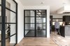 Modern home with Wood Cabinet, Light Hardwood Floor, and Granite Counter. Steel doors Photo 9 of Dutch Farmhouse