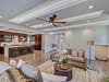 Modern home with Living Room, Accent Lighting, Recessed Lighting, Light Hardwood Floor, Sofa, and Console Tables. Living room has dog nook under the stairs Photo 10 of Contemporary Craftsman Home