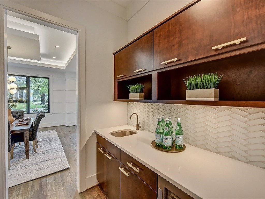 Butler's pantry with herringbone backsplash
