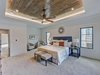 Modern home with Bedroom, Night Stands, Dresser, Ceiling Lighting, Bed, Accent Lighting, Recessed Lighting, and Carpet Floor. Sitting area in master bedroom Photo 14 of Contemporary Craftsman Home