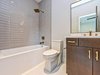 Modern home with Bath Room, Engineered Quartz Counter, Two Piece Toilet, Open Shower, and Ceramic Tile Floor. Secondary bathroom Photo 17 of Contemporary Craftsman Home
