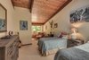 Modern home with Bedroom, Bed, Dresser, Storage, Shelves, Night Stands, Chair, Ceiling Lighting, Pendant Lighting, Table Lighting, and Carpet Floor. Bedroom 3 Photo 19 of Beautifully Designed Contemporary