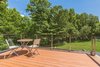 Modern home with Outdoor, Trees, Shrubs, Back Yard, Grass, Decking Patio, Porch, Deck, Horizontal Fences, Wall, Large Patio, Porch, Deck, and Metal Fences, Wall. Top Deck Photo 15 of Beautifully Designed Contemporary