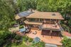 Modern home with Outdoor, Trees, Shrubs, Rooftop, Grass, Walkways, Large Patio, Porch, Deck, Wood Patio, Porch, Deck, and Decking Patio, Porch, Deck. Aerial Photo 4 of Beautifully Designed Contemporary