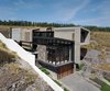 Modern home with Outdoor, Grass, Front Yard, and Field. Aerial View - Southeat Facade Photo 4 of Casa AB