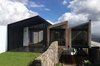 Modern home with Outdoor, Grass, Gardens, and Garden. Posterior / West Facade Photo 6 of Casa AB