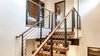 Modern home with Staircase, Metal Tread, Metal Railing, Wood Railing, Wood Tread, and Cable Railing. Staircase Photo 12 of Beaver Dam Luxury