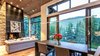 Modern home with Dining Room, Ceiling Lighting, Pendant Lighting, Accent Lighting, Recessed Lighting, Medium Hardwood Floor, and Gas Burning Fireplace. Living Area Photo 10 of Beaver Dam Luxury