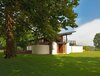 Modern home with Large Pools, Tubs, Shower, Small Patio, Porch, Deck, Decking Patio, Porch, Deck, Field, Wood Patio, Porch, Deck, Large Patio, Porch, Deck, Trees, Small Pools, Tubs, Shower, and Kitchen. A round stucco volume encloses the outdoor shower Photo of A Summer House