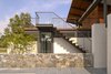 Modern home with Metal Tread, Metal Railing, Wood Railing, Wood Tread, Outdoor, Small Patio, Porch, Deck, Wood Patio, Porch, Deck, Large Patio, Porch, Deck, Field, Rooftop, Garden, and Stone Patio, Porch, Deck. Stairs to the upper viewing deck are steel and IPE open risers. Photo 3 of A Summer House