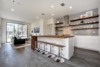 Modern home with Kitchen, Marble Counter, Wood Counter, White Cabinet, Engineered Quartz Counter, Mosaic Tile Backsplashe, Dark Hardwood Floor, Wood Cabinet, Refrigerator, Recessed Lighting, Wall Oven, Microwave, Ceiling Lighting, Drop In Sink, Cooktops, Ice Maker, Range, Dishwasher, Beverage Center, and Wine Cooler. Kitchen Photo 5 of Johanna