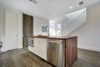 Modern home with Kitchen, Wood Counter, White Cabinet, Wood Cabinet, Dark Hardwood Floor, Mosaic Tile Backsplashe, Track Lighting, Refrigerator, Ceiling Lighting, Recessed Lighting, Microwave, Dishwasher, Wall Oven, Ice Maker, Cooktops, Wine Cooler, Range Hood, Range, Drop In Sink, and Beverage Center. Kitchen Photo 4 of Johanna