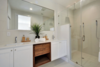 Modern home with Bath Room, Engineered Quartz Counter, Ceramic Tile Floor, Drop In Sink, Porcelain Tile Floor, Enclosed Shower, Full Shower, Ceiling Lighting, and Ceramic Tile Wall. Bathroom Photo 2 of Johanna