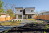 Modern home with Outdoor, Front Yard, Slope, Back Yard, Field, Desert, Side Yard, Garden, Trees, Grass, Hardscapes, Shrubs, Gardens, Walkways, Small Patio, Porch, Deck, Wood Patio, Porch, Deck, Large Patio, Porch, Deck, Horizontal Fences, Wall, Vertical Fences, Wall, and Wood Fences, Wall. Exterior Photo of Johanna