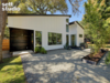 Modern home with Outdoor, Front Yard, Garden, Side Yard, Desert, Back Yard, Trees, Grass, Shrubs, Gardens, Large Patio, Porch, Deck, Wood Patio, Porch, Deck, Hardscapes, Small Patio, Porch, Deck, Concrete Patio, Porch, Deck, Horizontal Fences, Wall, and Vertical Fences, Wall. Exterior Photo 7 of Strass I