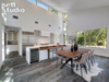 Modern home with Kitchen, Granite Counter, Quartzite Counter, Marble Counter, Engineered Quartz Counter, Wood Counter, Tile Counter, Stone Counter, Concrete Counter, Metal Counter, Laminate Counter, Wood Cabinet, White Cabinet, Medium Hardwood Floor, Travertine Floor, Concrete Floor, Light Hardwood Floor, Dark Hardwood Floor, Vinyl Floor, and Porcelain Tile Floor. Kitchen Photo 4 of Strass I