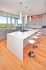 Modern home with Kitchen, Engineered Quartz Counter, Colorful Cabinet, Pendant Lighting, Glass Tile Backsplashe, Light Hardwood Floor, Accent Lighting, Cooktops, Recessed Lighting, Beverage Center, Wine Cooler, Dishwasher, and Undermount Sink. kitchen Photo 3 of Westlake1
