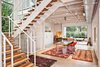 Modern home with Glass Railing, Wood Tread, Metal Tread, Metal Railing, Craft Room Room Type, Storage, Desk, Chair, Lamps, Bookcase, Shelves, Concrete Floor, Carpet Floor, and Staircase. art studio Photo 4 of Westlake1