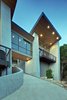 Modern home with Front Yard, Slope, Woodland, Trees, Shrubs, Raised Planters, Boulders, Wood Patio, Porch, Deck, Large Patio, Porch, Deck, Decking Patio, Porch, Deck, Metal Patio, Porch, Deck, Hanging Lighting, Windows, Picture Window Type, Single Hung Window Type, Sliding Window Type, and Metal. master retreat and office bridge Photo 2 of Westlake2