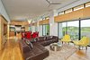 Modern home with Chair, Sectional, Coffee Tables, Ceiling Lighting, Pendant Lighting, Wall Lighting, Recessed Lighting, Light Hardwood Floor, Dining Room, Storage, and Table. great room Photo 5 of Westlake2