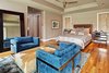 Modern home with Bedroom, Night Stands, Bed, Chair, Carpet Floor, Recessed Lighting, and Medium Hardwood Floor. master bedroom Photo of Westlake3