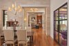 Modern home with Chair, Table, Recessed Lighting, Pendant Lighting, Medium Hardwood Floor, Standard Layout Fireplace, Wood Burning Fireplace, Living Room, and Coffee Tables. dining/entry/living Photo 5 of Westlake3