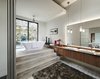 Modern home with Bath Room, Engineered Quartz Counter, Ceramic Tile Floor, Carpet Floor, Freestanding Tub, Vessel Sink, Pendant Lighting, Soaking Tub, Recessed Lighting, Accent Lighting, and Wall Lighting. master bath 1 Photo 10 of Westlake4