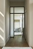 Modern home with Light Hardwood Floor, Chair, Recessed Lighting, Ottomans, Carpet Floor, Doors, Swing Door Type, Metal, and Interior. master entry 1 Photo 12 of Westlake4