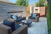 Modern home with Outdoor, Shrubs, Back Yard, Garden, Hardscapes, Small Pools, Tubs, Shower, Stone Patio, Porch, Deck, Horizontal Fences, Wall, Large Patio, Porch, Deck, Metal Patio, Porch, Deck, Metal Fences, Wall, and Landscape Lighting. outdoor living room-morning Photo 4 of Mueller 1