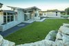 Modern home with Outdoor, Front Yard, Grass, Hardscapes, Walkways, Raised Planters, Boulders, Shrubs, Tile Patio, Porch, Deck, Stone Patio, Porch, Deck, Horizontal Fences, Wall, Stone Fences, Wall, Retaining Fences, Wall, Landscape Lighting, Slope, and Field. Front courtyard and entry sequence Photo of The U V House