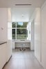 Modern home with Office, Chair, Storage, Desk, and Porcelain Tile Floor. desk detail in the mud/laundry area overlooking the front courtyard Photo 11 of The U V House