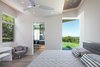 Modern home with Bedroom, Bed, Chair, Ceiling Lighting, and Ceramic Tile Floor. guest master bedroom Photo 16 of The U V House