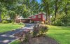 Modern home with Outdoor, Trees, Shrubs, Grass, and Front Yard. Front Right View Photo of Classic Mid Century Modern home for sale
