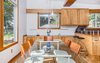 Modern home with Dining Room, Track Lighting, Table, Storage, Chair, and Cork Floor. Dining Area Photo 10 of Classic Mid Century Modern home for sale
