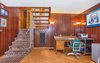 Modern home with Living Room, Floor Lighting, Table Lighting, Cork Floor, Accent Lighting, and Wood Burning Fireplace. Family Room Photo 15 of Classic Mid Century Modern home for sale